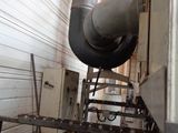 a picture of a man working on a machine in a factory