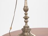 a lamp that is on a table with a red shade