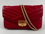 a red bag with a gold clasp and chain on a white background