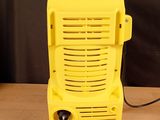 a yellow radio sitting on top of a wooden table