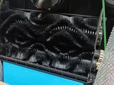 a black suitcase with a black fur inside of it