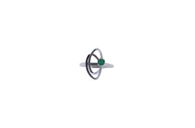an image of a ring with a green stone in it