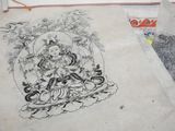 a drawing of a buddha on a piece of paper