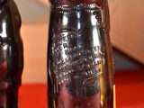 two bottles that are sitting next to each other on a table