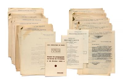 several papers are stacked on top of each other on a white surface