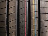 a close up of a tire on a stand with a box in the background