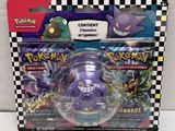 the box contains a toy figure of a purple pokemon figure