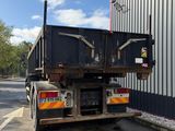 a large truck that is parked in front of a building