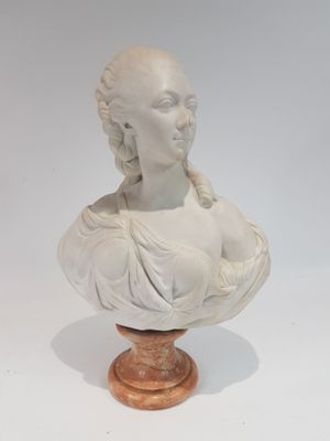 marble bust of a woman with braids on a wooden base