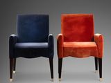 pair of velvet armchairs with brass legs