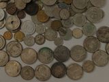 a lot of coins that are on the table