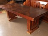 a wooden bench and a table in a room