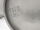 an image of a close up of a metal object on a white surface