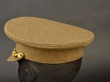 a hat on a mannequin head on a black background