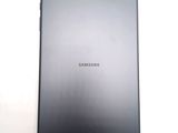 a close up of the back of a black samsung tablet