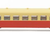 a yellow and red train car on a white background