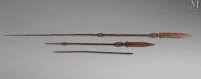 three different types of weapons are displayed on a gray surface