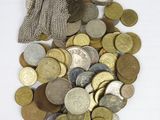a bag full of coins and a clock on the table