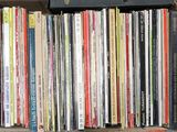 a lot of books that are on a shelf together
