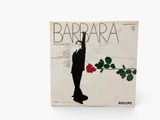 the cover of barbara ' s album, featuring a silhouette of a man holding a rose