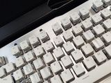 a computer keyboard sitting on top of a desk