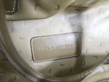 an image of a close up of a purse with a tag on it