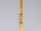 an orange and black pen sitting on top of a clear base