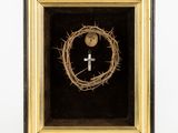 a close up of a cross and a crown of thorns in a frame
