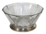 a glass bowl with a metal base on a white background