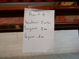 a sign on a bench that reads back by the weather bomb