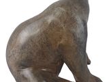 statue of a bear sitting on its back on a white background