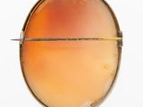 an image of a close up of a metal object on a white surface