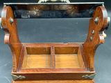 a small wooden box with two compartments on it