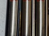 four books are lined up in a row on a table