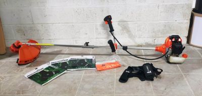a few tools that are on the floor next to a wall