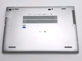 the back of a laptop with a blue sticker on the bottom of it