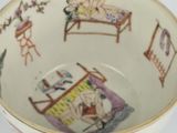 a bowl with a picture of a woman in a bed on it