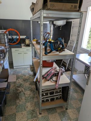 a shelf with tools on it in a kitchen