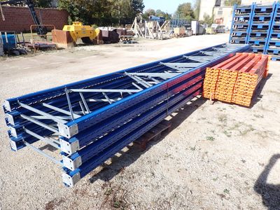 a close up of a pile of pallets sitting on top of a dirt field