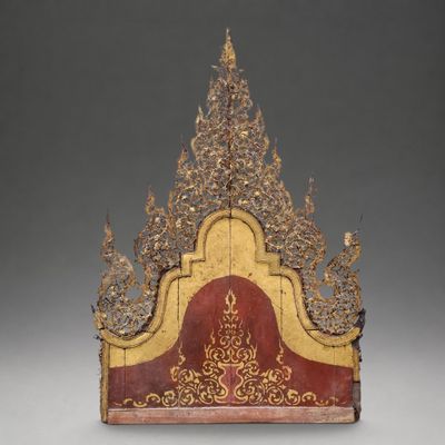 an image of a gold and red headboard on a gray background