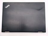 a black laptop that is sitting on a white table