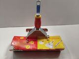 a red and yellow toy boat on a white table