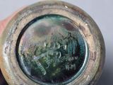 a close up of a person holding a bottle with a picture on it