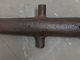 an old rusted pipe on the floor in the room