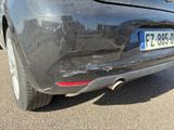 the rear end of a car with a broken bumper is shown