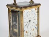 a small clock that is sitting on a table