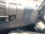 a dashboard of a car with a remote control