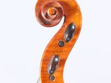 a close up of a violin on a white surface with a white background