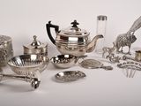 many silver objects on a white surface