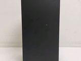 the back of a black box sitting on top of a white table
